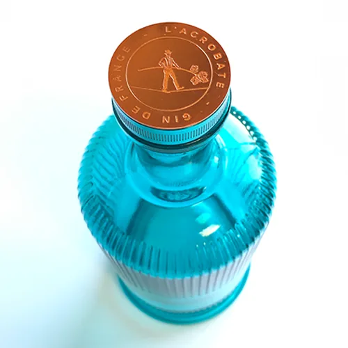 Bouteille turquoise · Bouchon cuivre — réalisation Maq’Exe